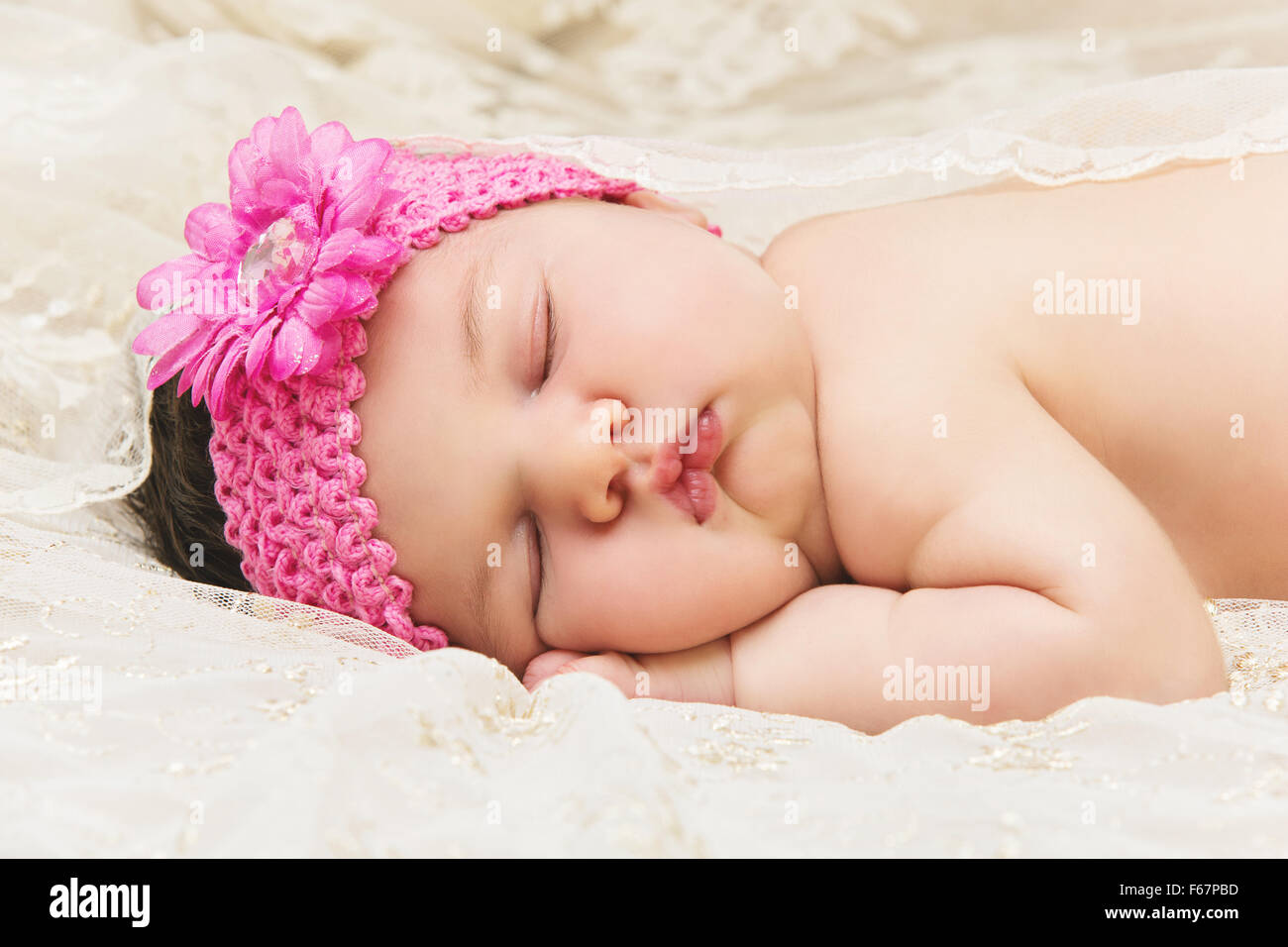 Newborn baby girl sleeping on stomach Stock Photo Alamy