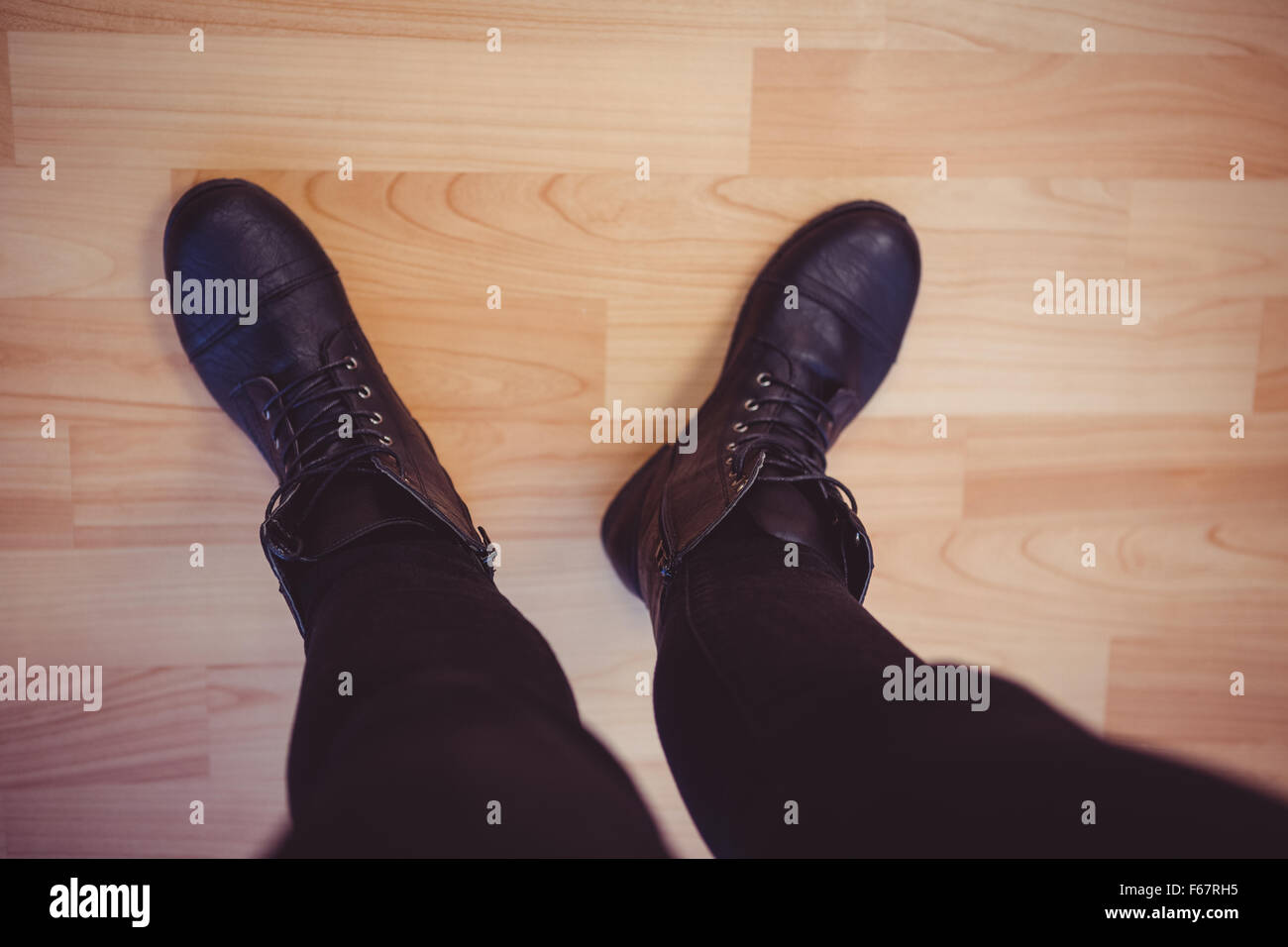 Cropped image of woman wearing boots Stock Photo