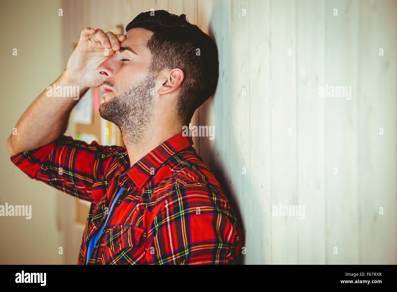 Handsome hipster feeling stressed out Stock Photo