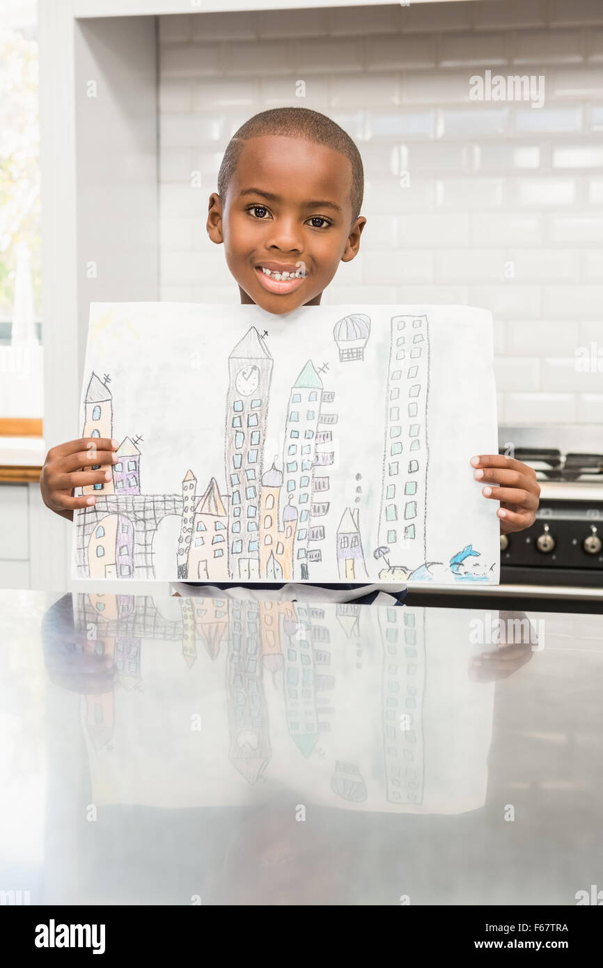 Smiling boy showing his drawing Stock Photo Alamy