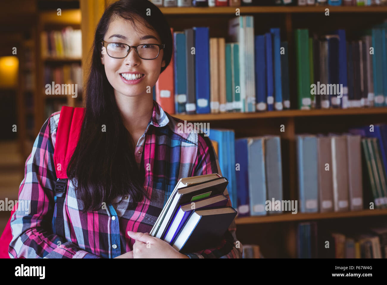 Student holding a book hi-res stock photography and images - Alamy