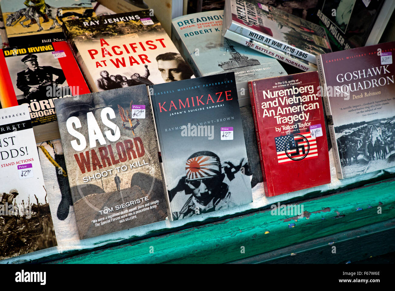 Books on war in the window of a charity bookshop in Edinburgh. Stock Photo