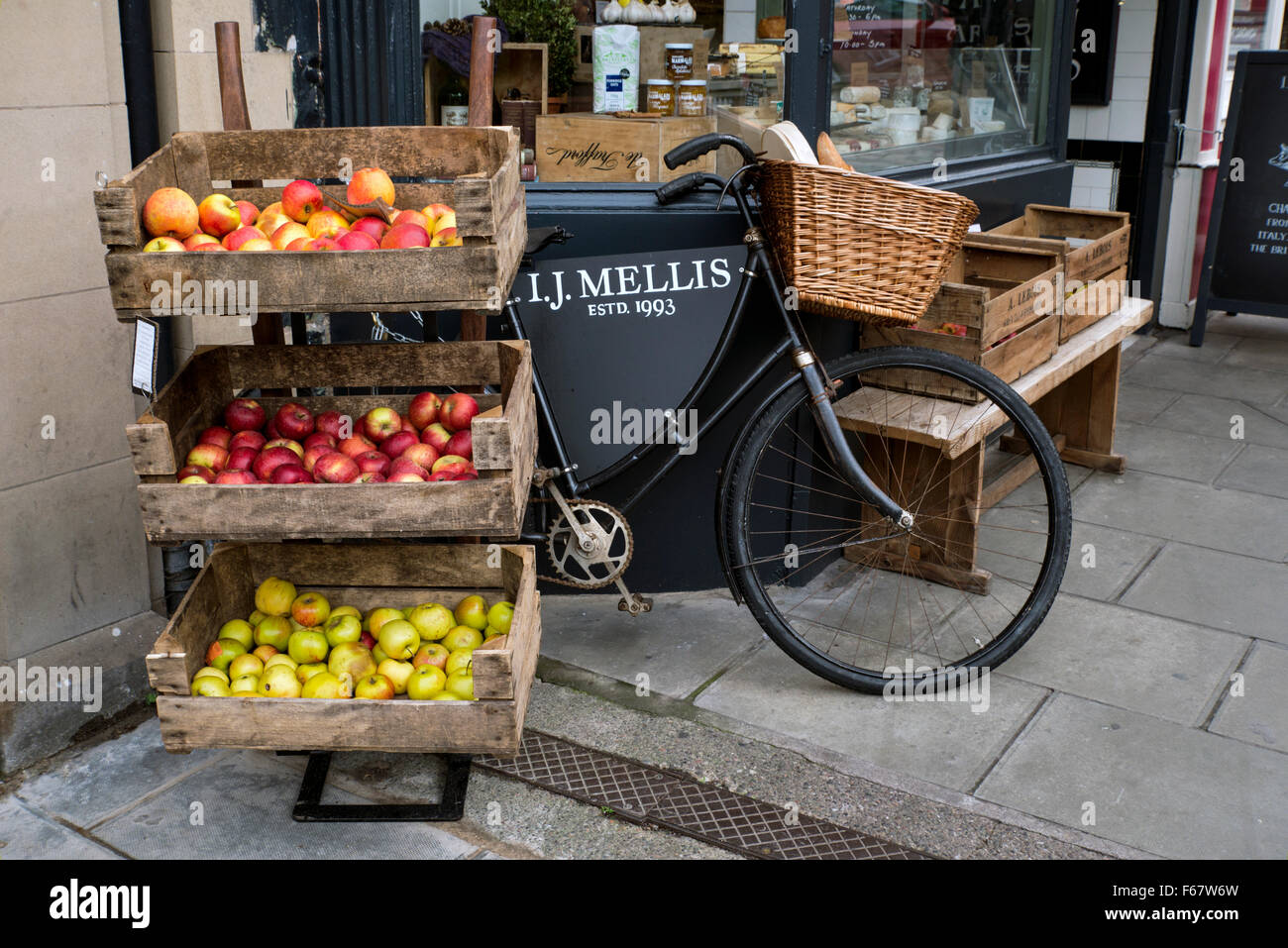 Boxes of apples on display outside the shop of I J Mellis, Cheesemonger, in Stockbridge, Edinburgh. Stock Photo