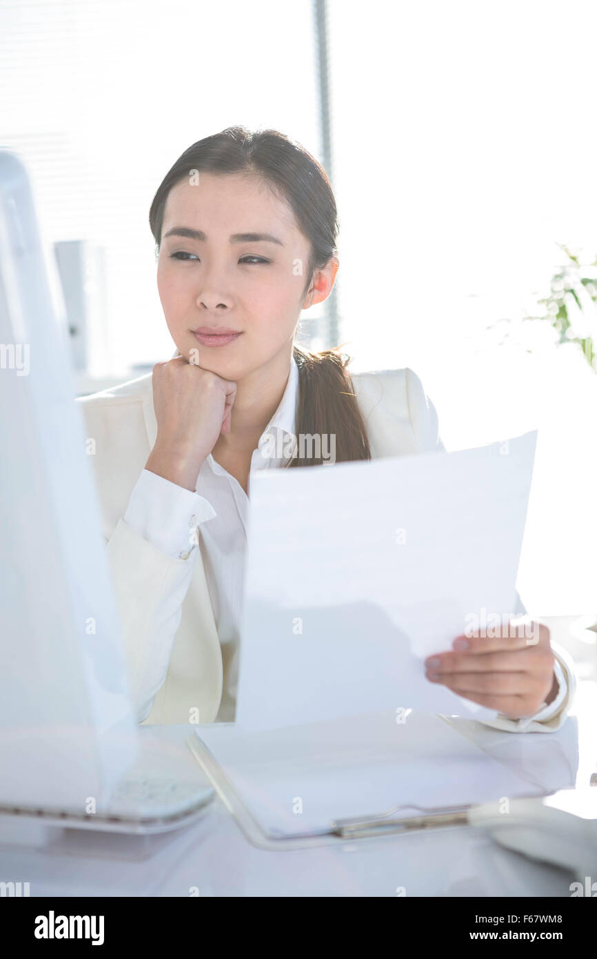 Smiling businesswoman using computer Stock Photo - Alamy