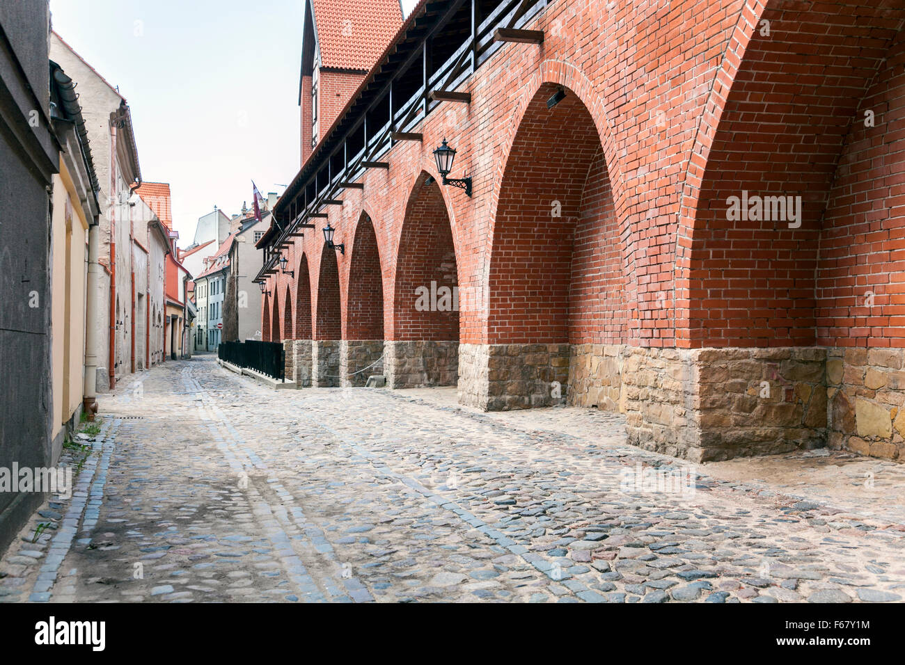 Cobblestone street and defensive town wall in Riga's Old Town, Riga ...