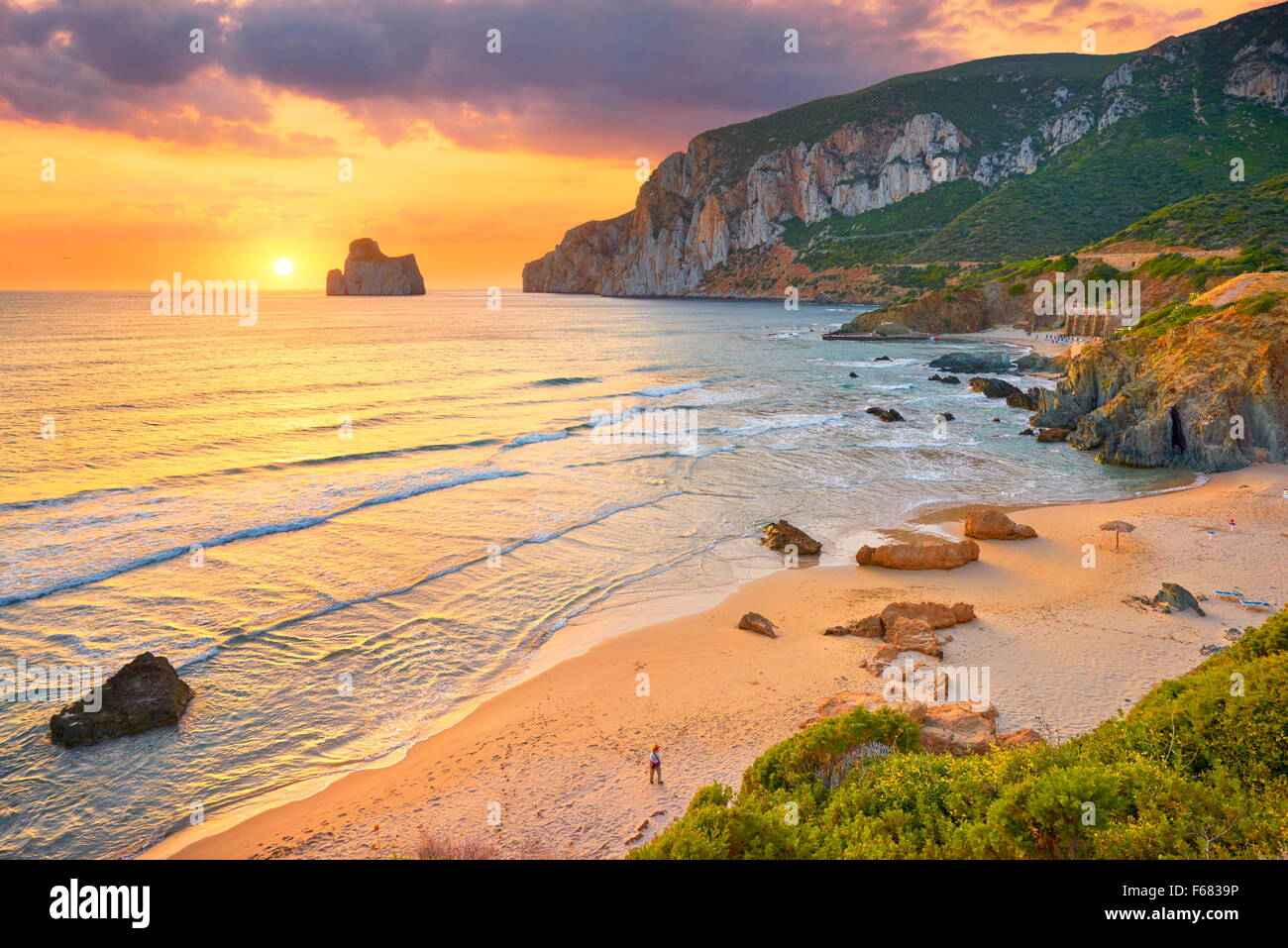 Pan di Zucchero at sunset time, Masua Village Beach, Sardinia Island, Italy Stock Photo