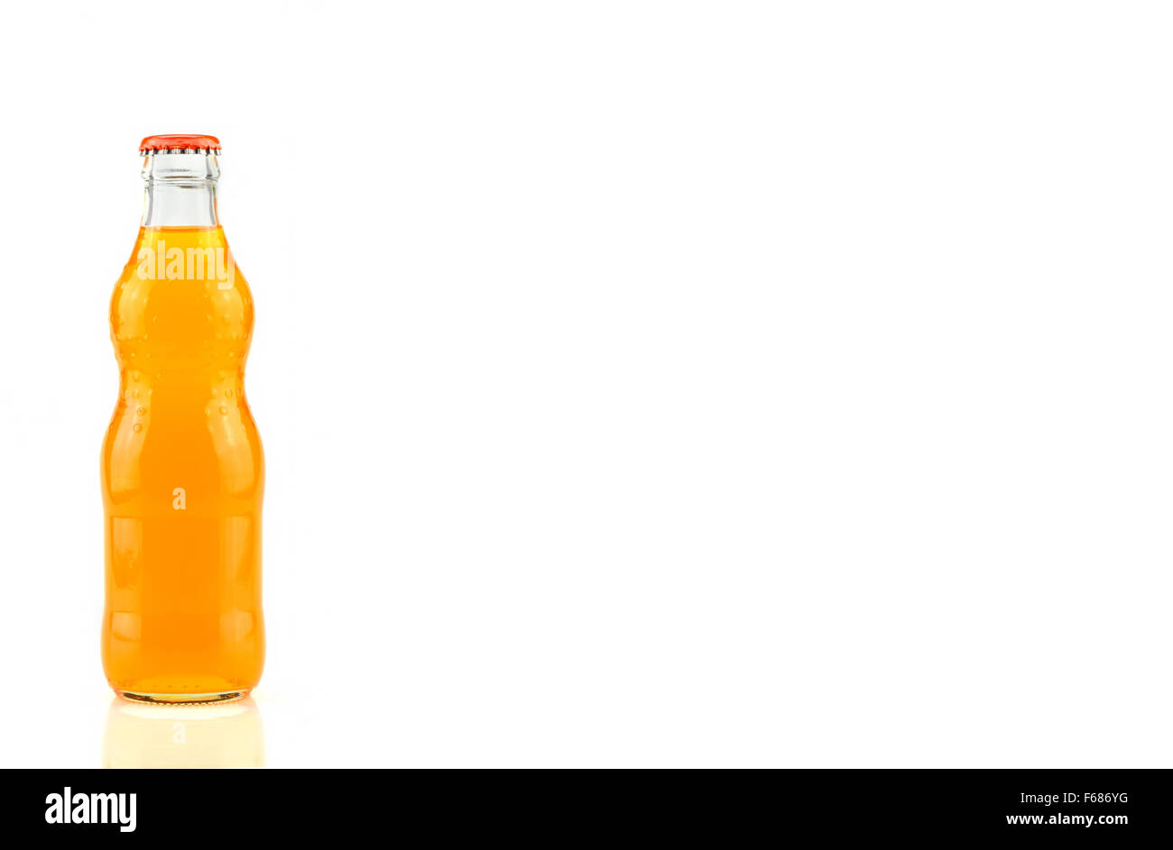 bottle of  Orange Fanta (coca cola) glass soda isolated on a white background Stock Photo