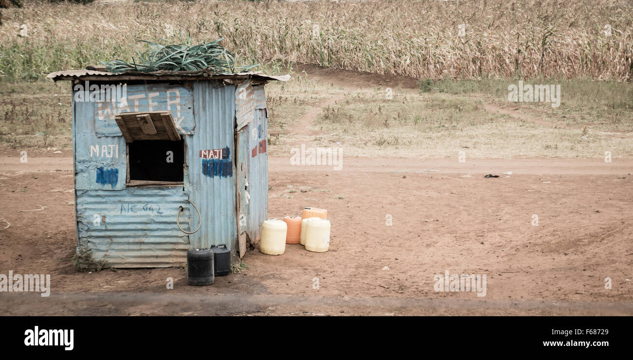 An African shop to buy water on the side of a street. Stock Photo