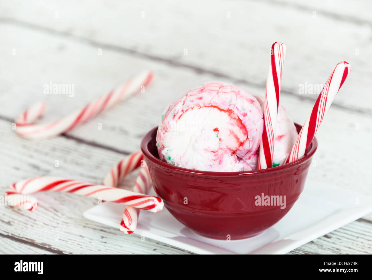 Peppermint ice cream and candy canes in a red bowl Stock Photo Alamy