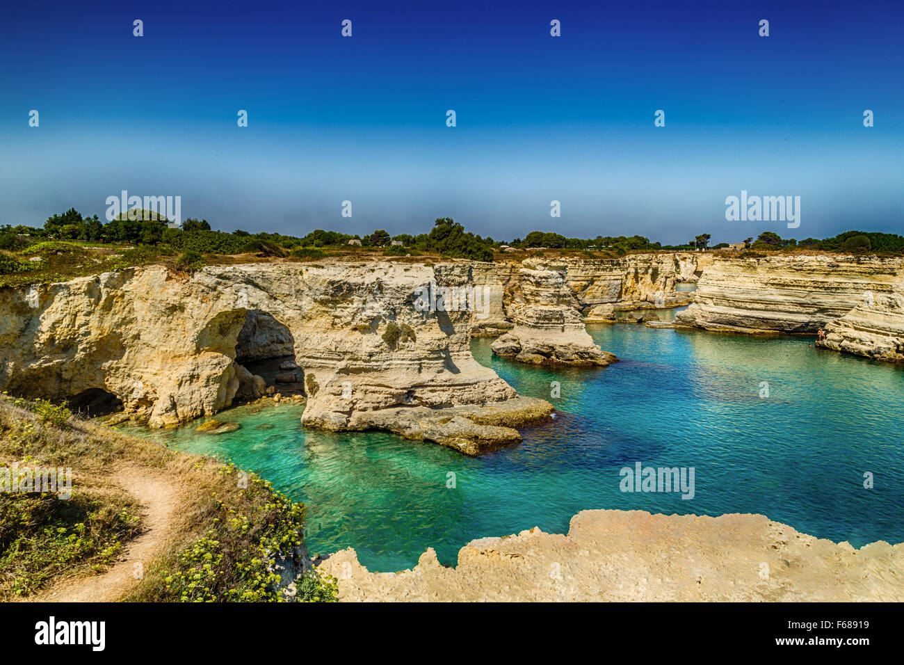 Rocky stacks of Santo Andrea on the coast of Salento in Puglia in Italy Stock Photo