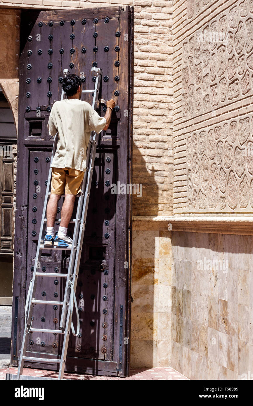 Toledo Spain,Europe,Spanish,Hispanic man men male,ladder,repair,renovation,working,door,Spain150703098 Stock Photo