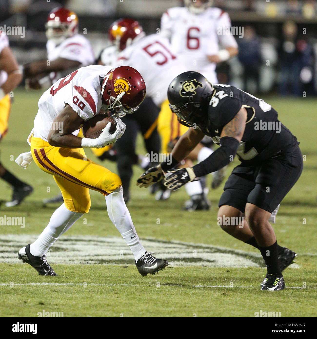 Boulder. 13th Nov, 2015. USC's Christian Rector prepares to take a big hit from Colorado's Rick Gamboa in the first half against Colorado Friday night in Boulder. USC won, 27-24. © csm/Alamy Live News Stock Photo