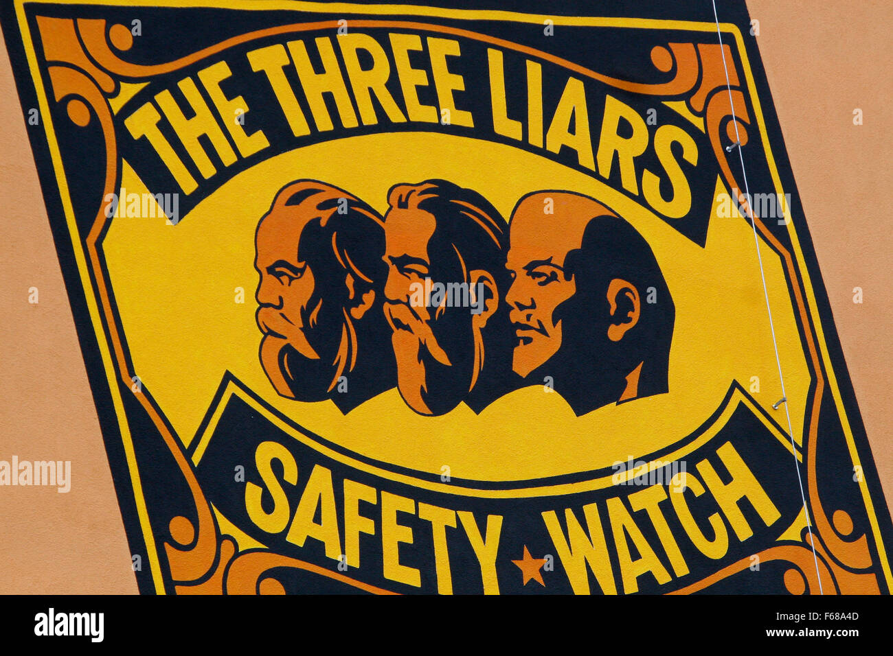 The three liars - Marx, Engels, Lenin image and the words .. they have never been ignited, on the wall  Plzen, Czech Republic Stock Photo