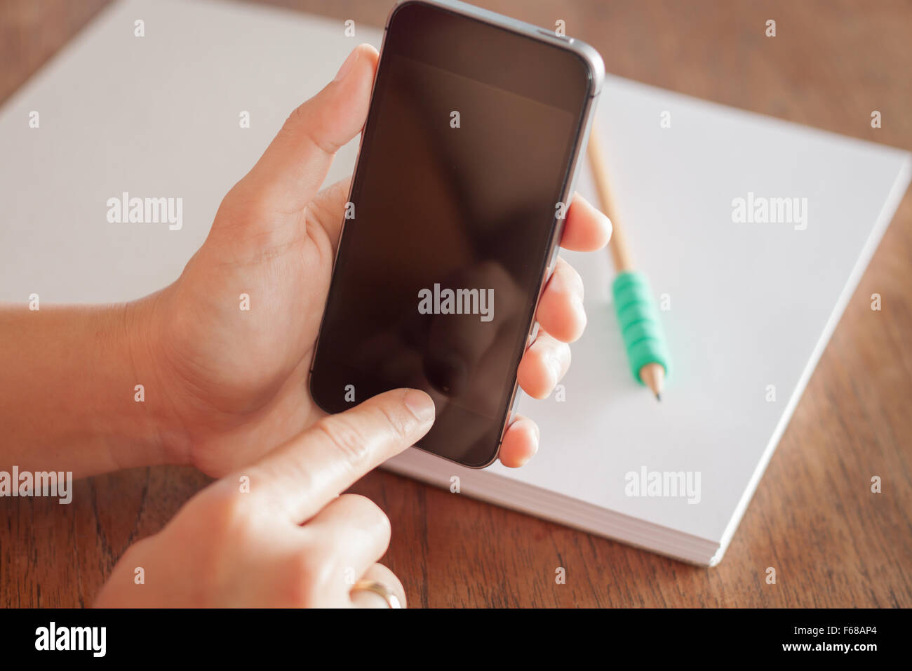 Smart phone in a woman's hand, stock photo Stock Photo