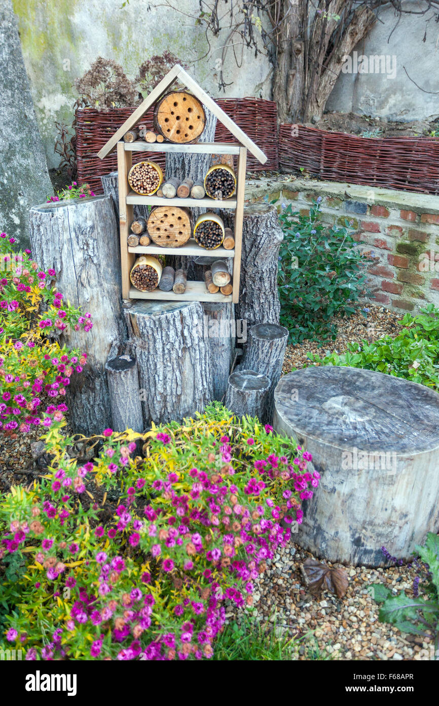 Insect hotel in the garden for different bugs, insects, and bees in the garden, bee hotel