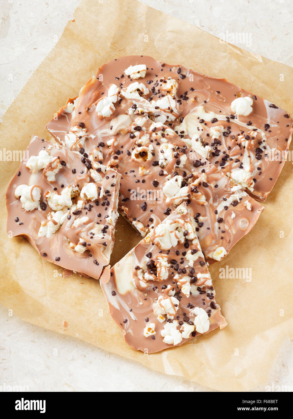 Homemade chocolate bar with milk and white chocolate, popcorn and popping  candy Stock Photo - Alamy