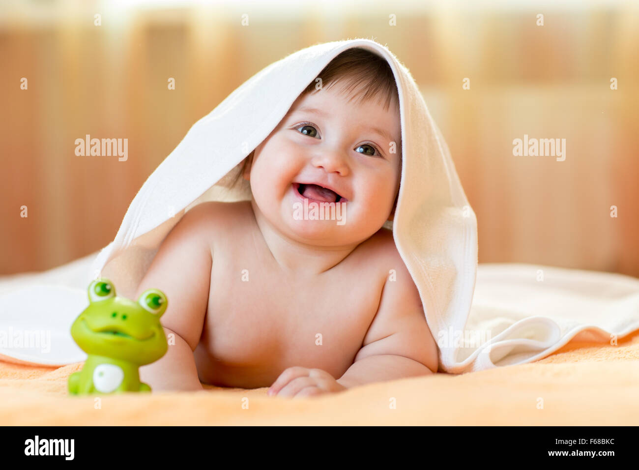 Funny Baby Kid Under A Hooded Towel After Bath Funny Baby Kid Under A Hooded Towel After Bath