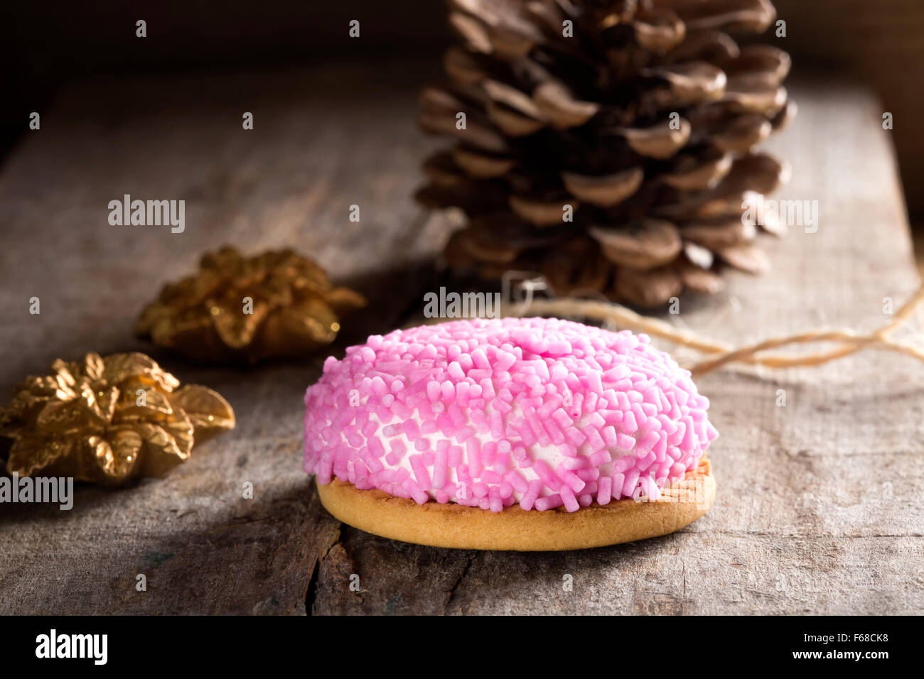 Marshmallow cookie with pink sprinkles on top and Christmas Ornaments Stock Photo