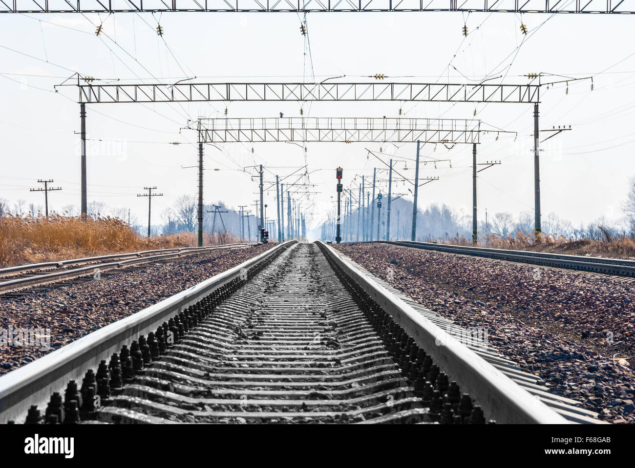 Railroad tracks stretching into the distance beyond the horizon Stock