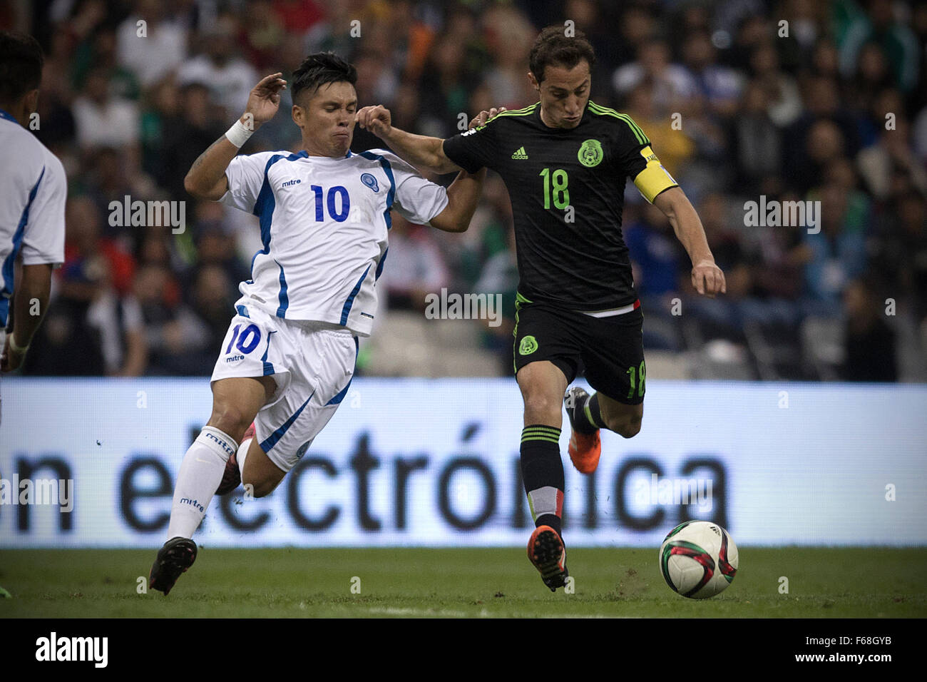 Mexico City, Mexico. 13th Nov, 2015. Andres Guardado (R) of Mexico vies with Jaime Alas of El Salvador during their 2018 Russia World Cup qualifying match at Azteca Stadium in Mexico City, capital of Mexico, on Nov. 13, 2015. Mexico won 3-0. Credit:  Alejandro Ayala/Xinhua/Alamy Live News Stock Photo
