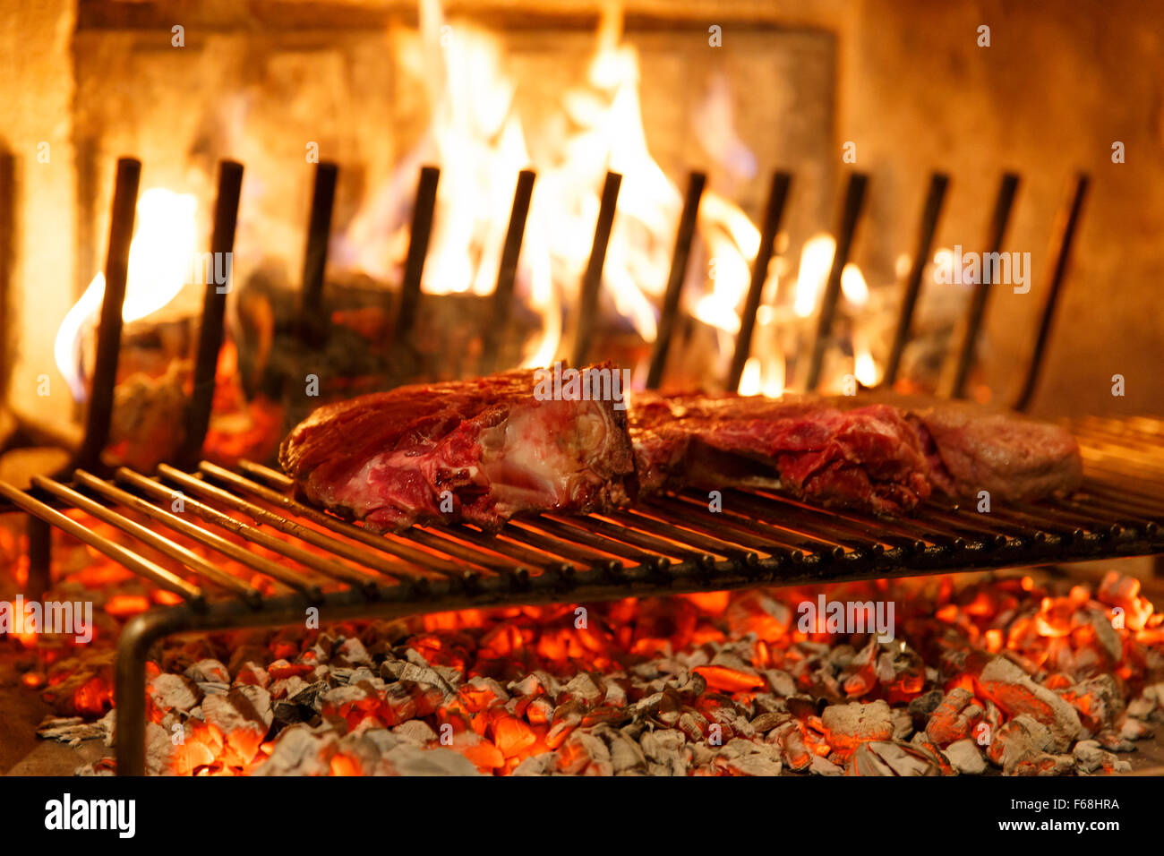 A top sirloin steak flame broiled on a barbecue, shallow depth of field. Stock Photo