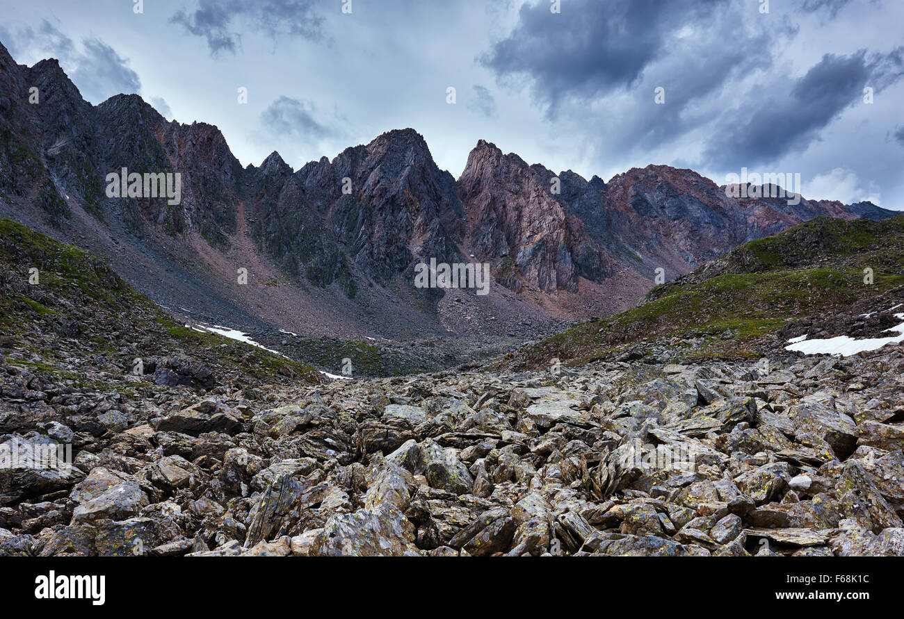 The sharp fragments of rock on background of a mountain range. Eastern Sayan. The Republic of Buryatia Stock Photo