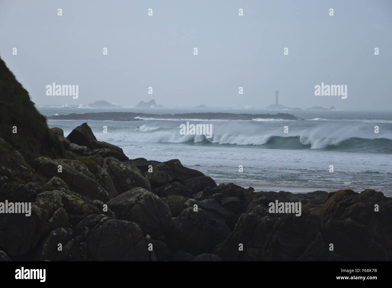 Waves longships lighthouse Stock Photo