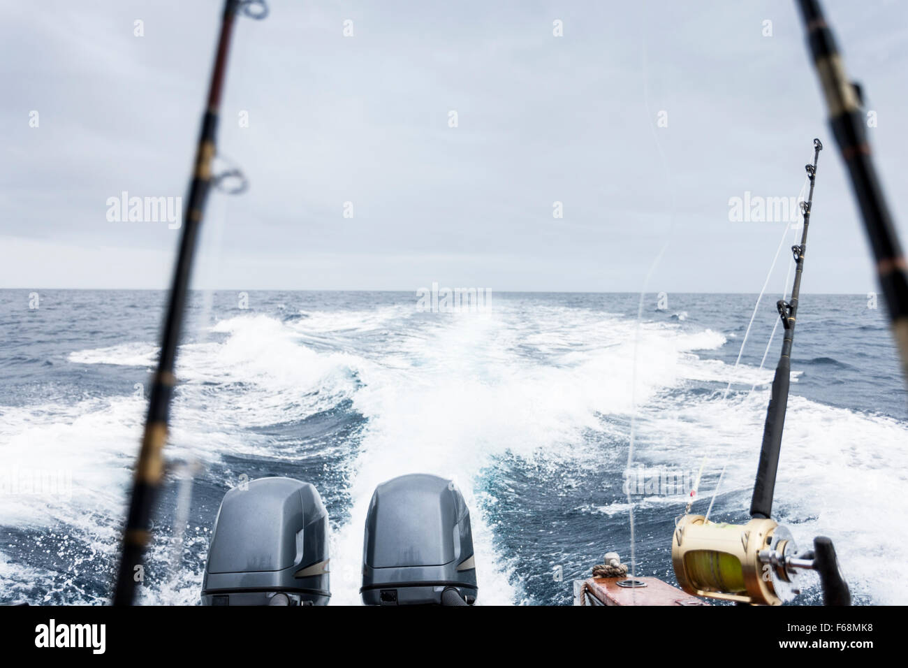 Twin engines on the back of a boat displaying power and speed, fishing