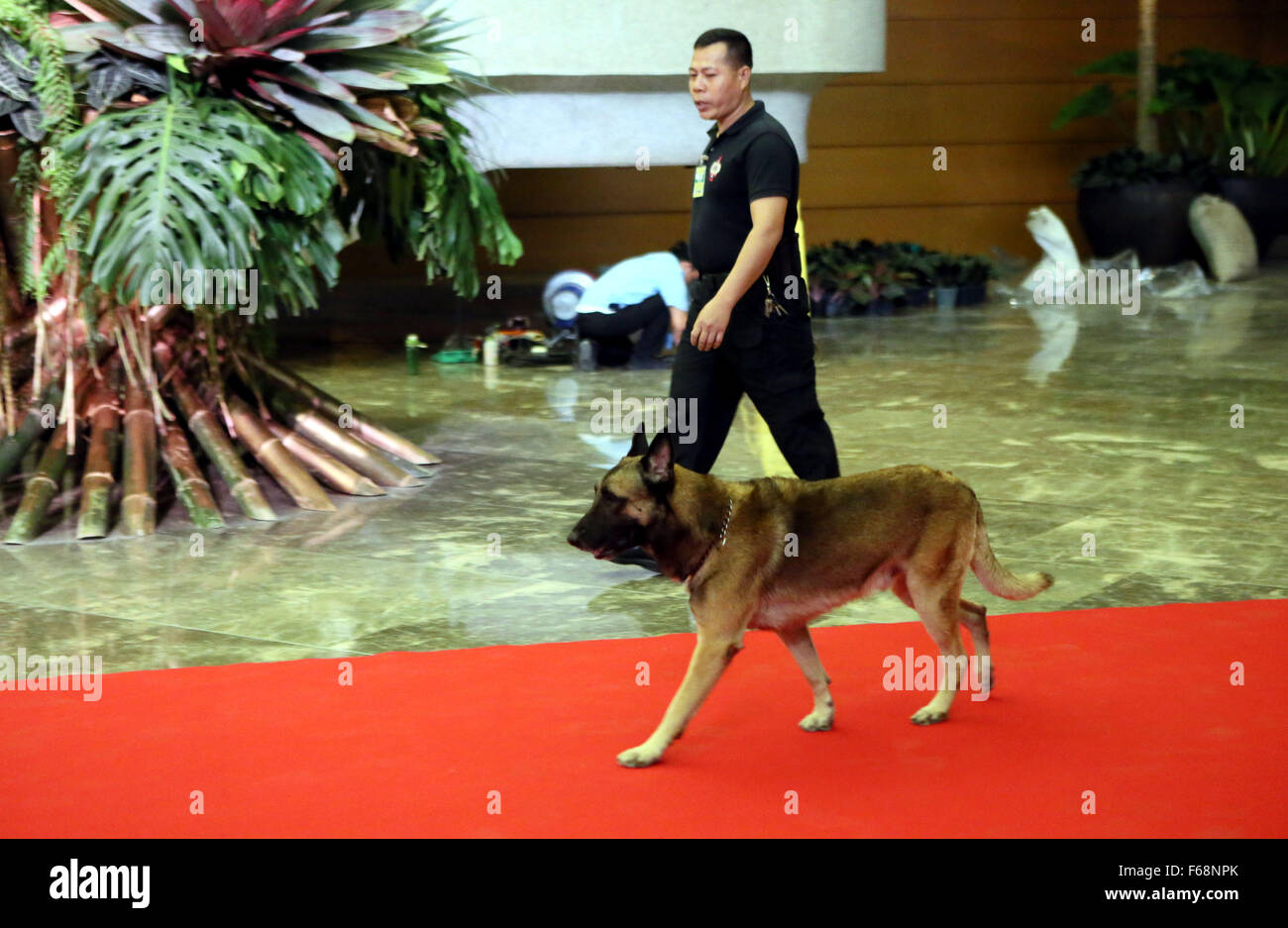 Manila, Philippines. 14th Nov, 2015. A policeman uses a dog to check ...