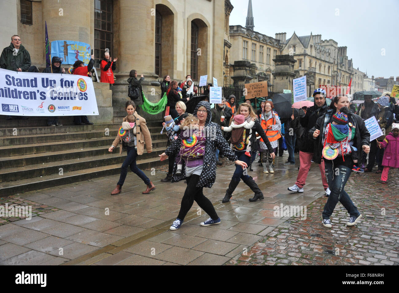 Oxford, UK. 14th November, 2015. Save Our Children's Centres protest march through Oxford to protest at the proposed closure to the counties children centres. During the week a letter from the Prime Minister, Rt Hon David Cameron, MP for Witney in West Oxfordshire, called the cuts “unwelcome and counter-productive” in leaked letter to Oxfordshire County Council chair Cllr Ian Hudspeth. Save Oxfordshire Children's Centres Campaign spokesperson Jill Huish said: ‘Cameron can't plead not guilty. Credit:  Desmond Brambley/Alamy Live News Stock Photo