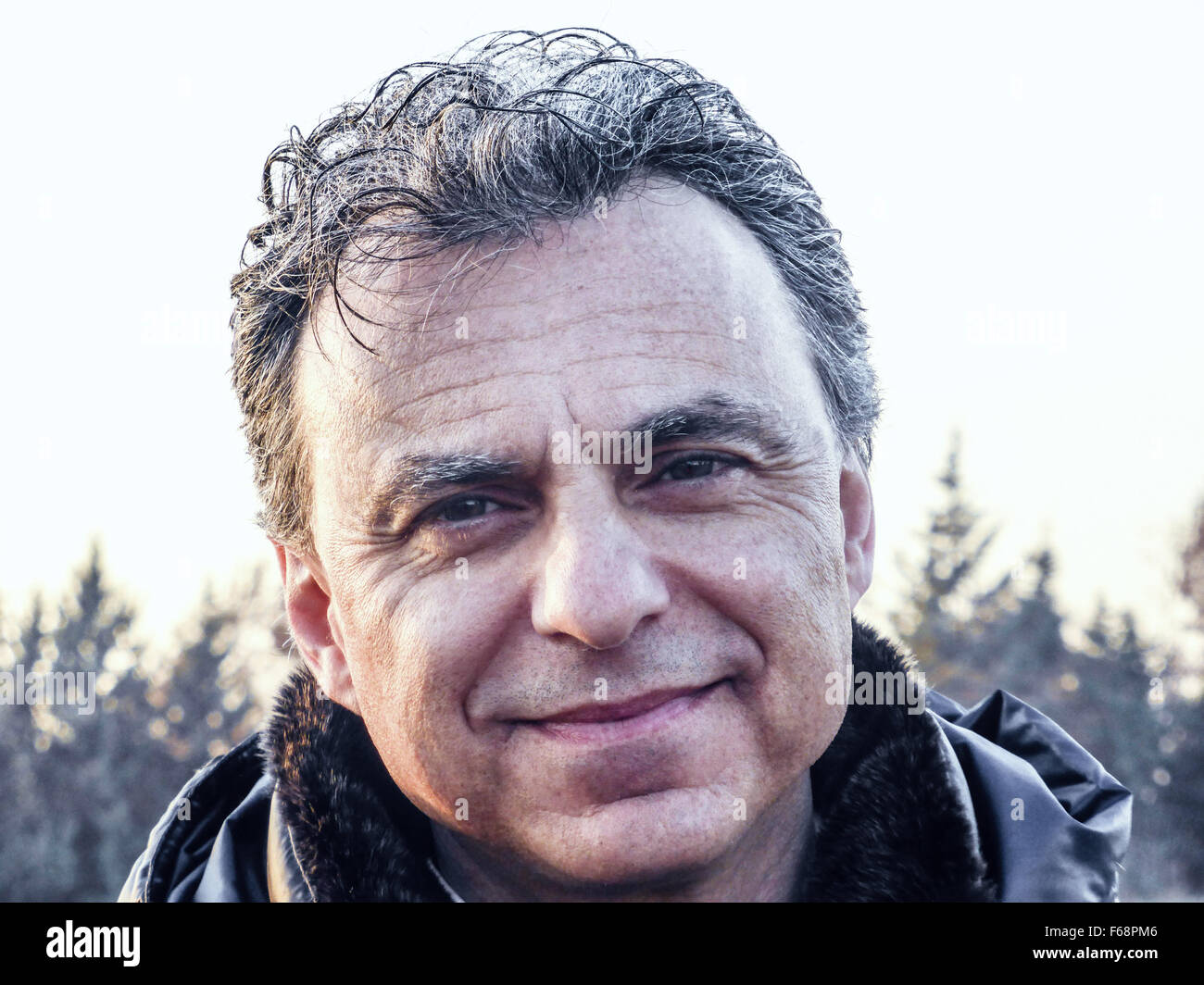 Elegant Middle Aged Man With Green Eyes And Salt Pepper Hair
