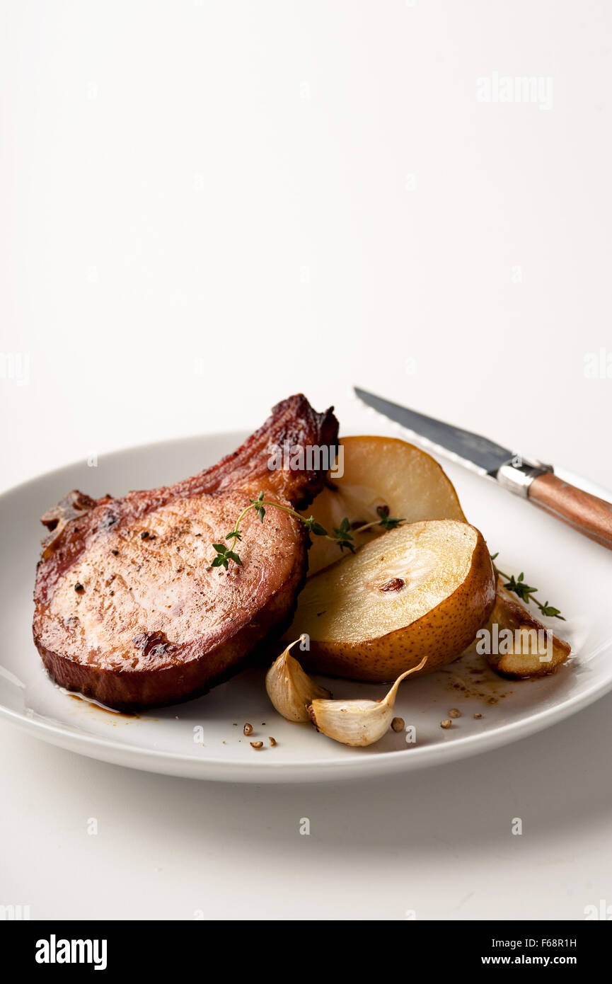 Roasted pork chop and pears with garlic,pepper & herb seasoning Stock Photo Alamy