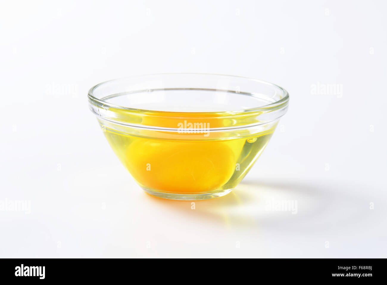 Fresh egg white and yolk in glass bowl Stock Photo