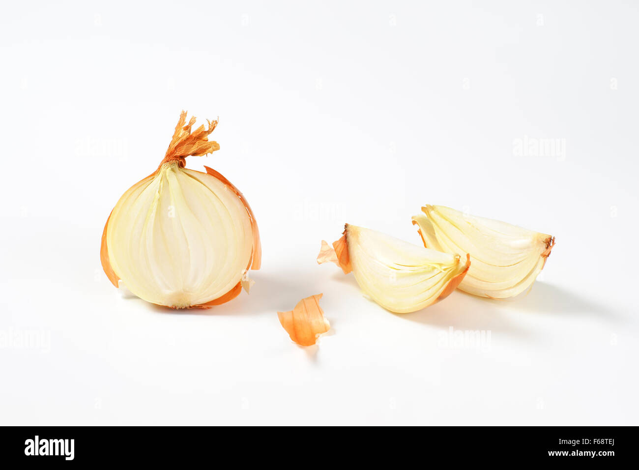 sliced raw onion on white background Stock Photo - Alamy