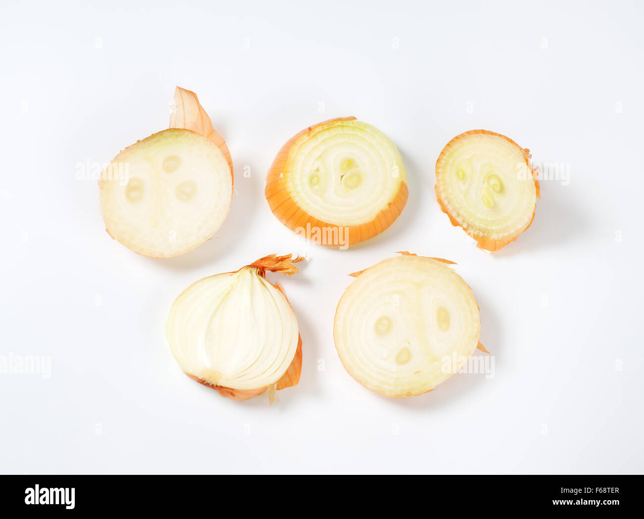 sliced raw onion on white background Stock Photo - Alamy