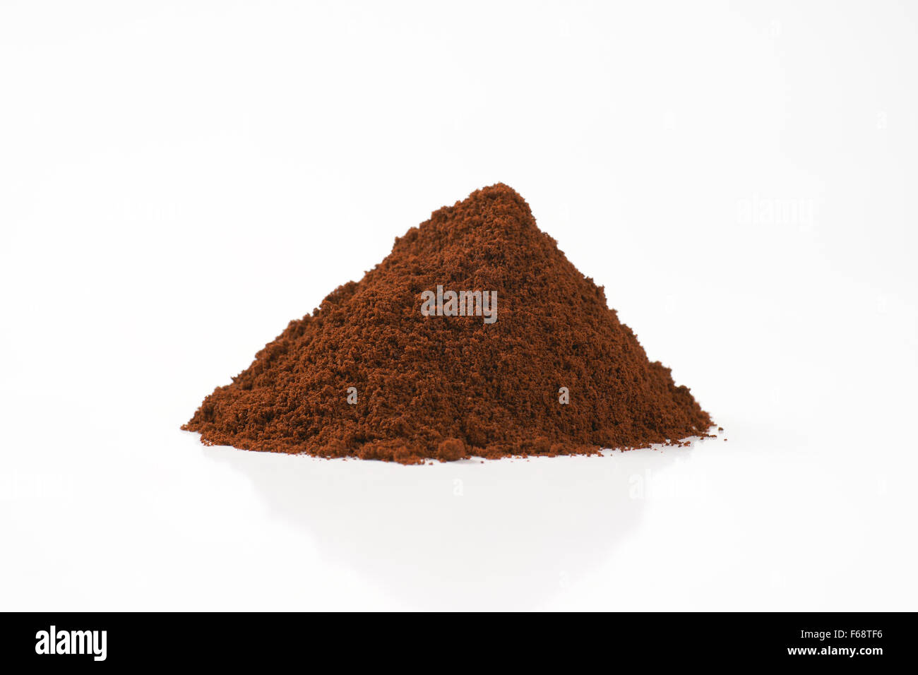 heap of freshly ground coffee on white background Stock Photo Alamy