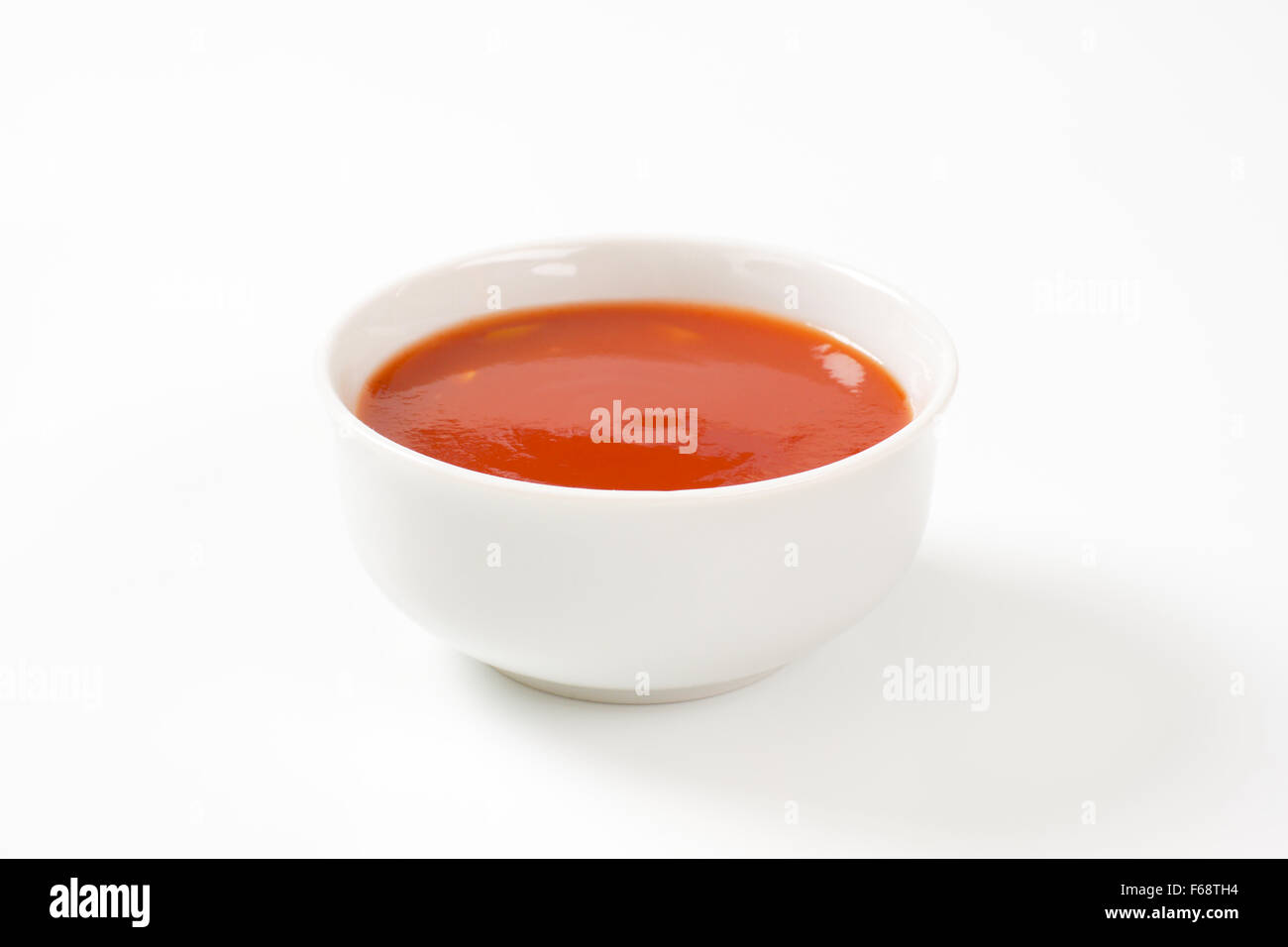 bowl of tomato soup on white background Stock Photo - Alamy
