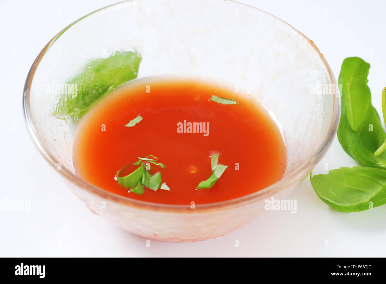 bowl of tomato soup on white background Stock Photo - Alamy