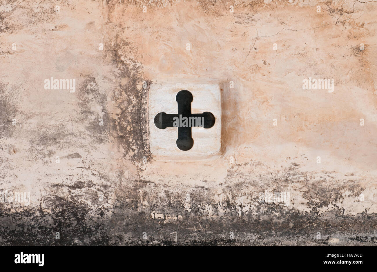 Cross orthodox Christian religious symbol on a church wall Stock Photo