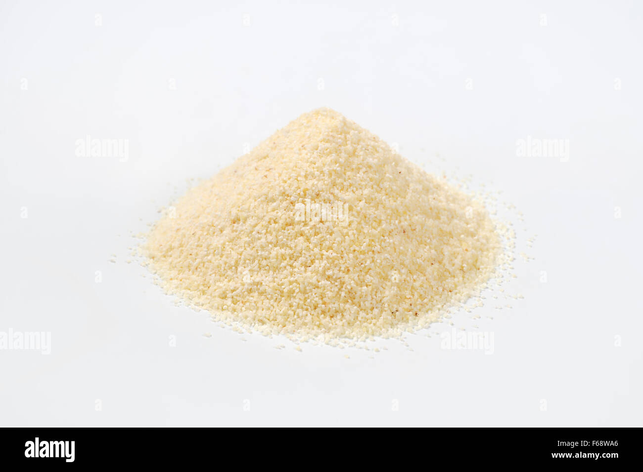 heap of grits on white background Stock Photo