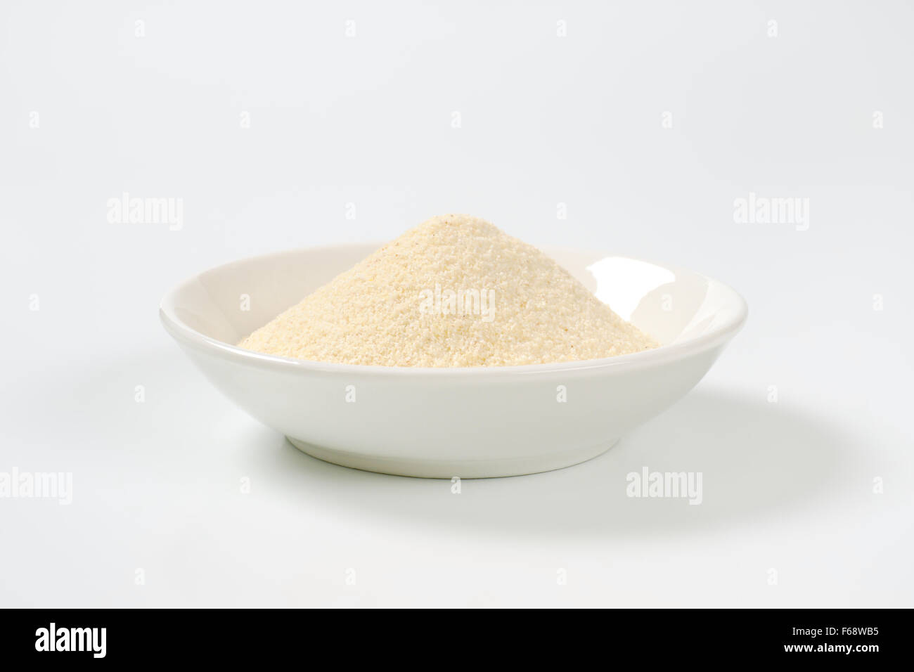soup plate of grits on white background Stock Photo