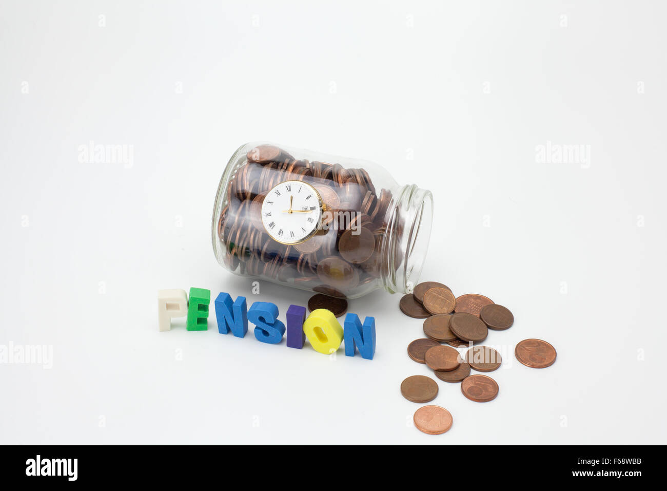 Pension coins in a glass jar with text and clock Stock Photo