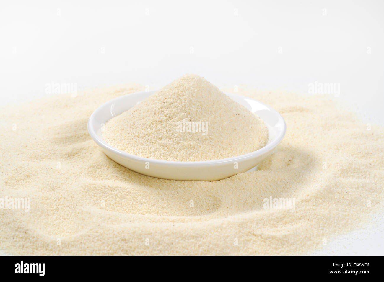 soup plate of grits on white background Stock Photo