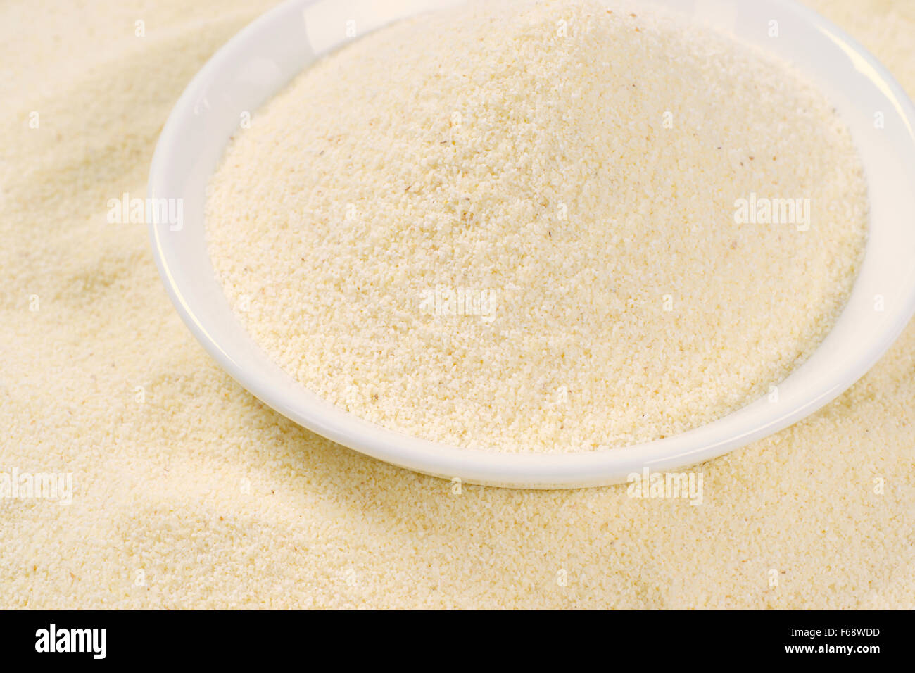 close up of grits in white soup plate Stock Photo