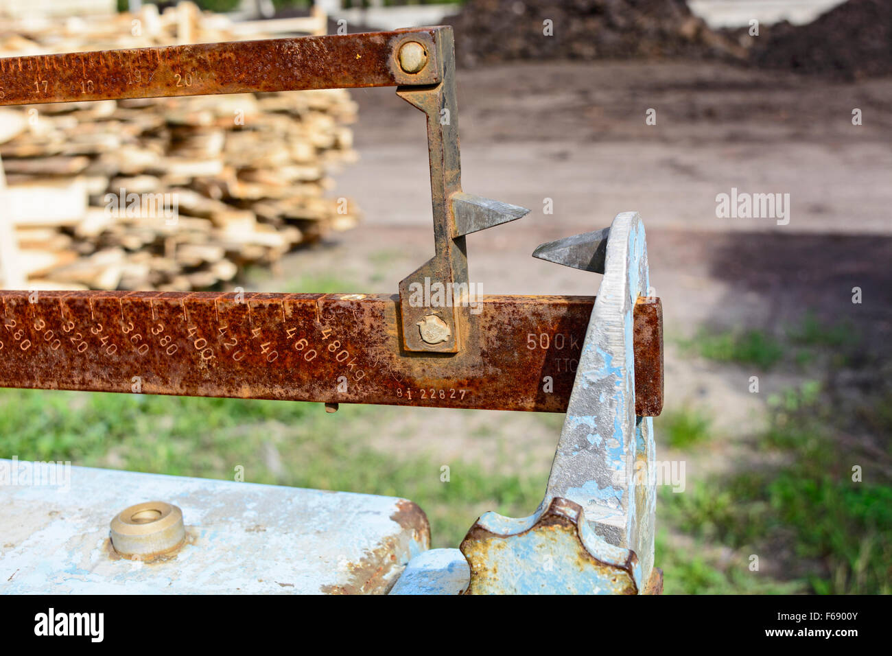 The tab on the old scale which is in stock building materials. Stock Photo