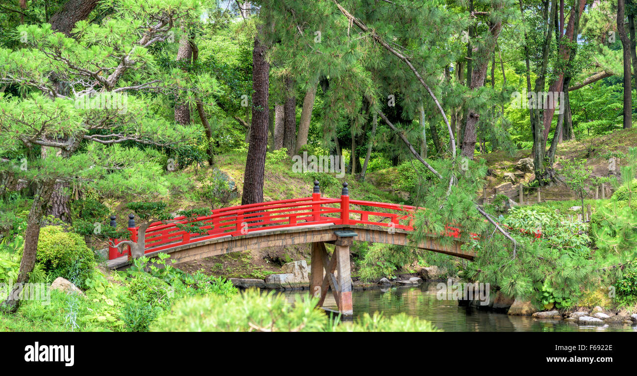 Red bridge in a Japanese garden Stock Photo - Alamy
