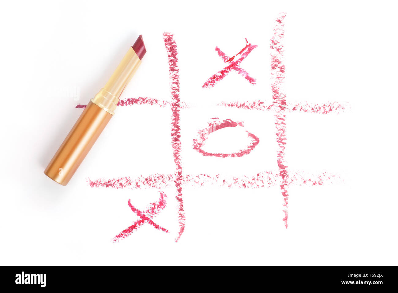 Smudge lipstick drawing. Tic-tac-toe on white background Stock Photo