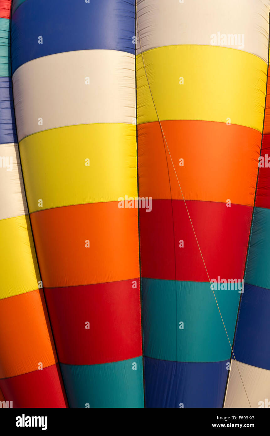 Close up of multi-colored balloon, red, orange, yellow, blue, turquoise, and white Stock Photo