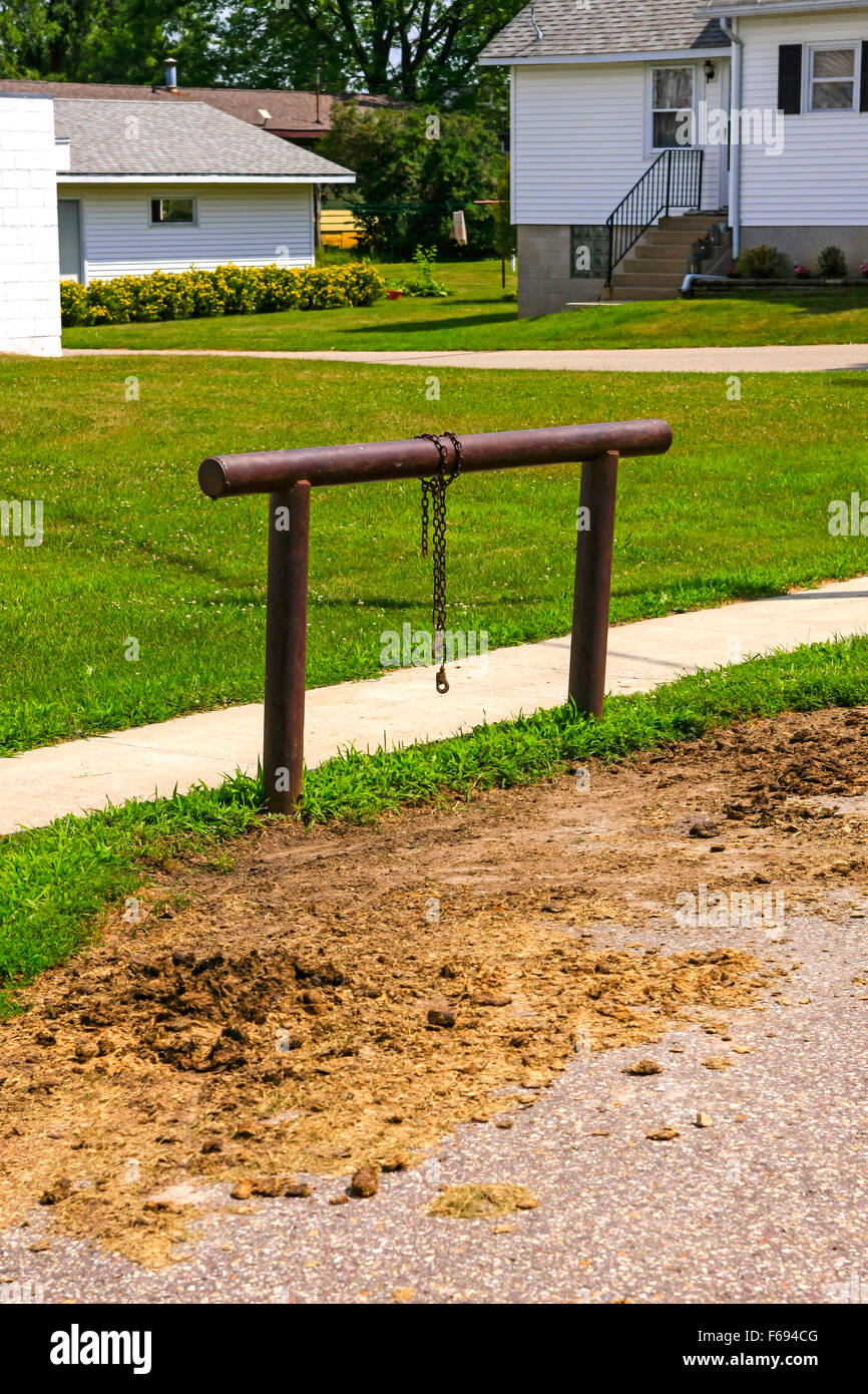 Metal hitching post for Amish horses in a small rural town in Wisconsin