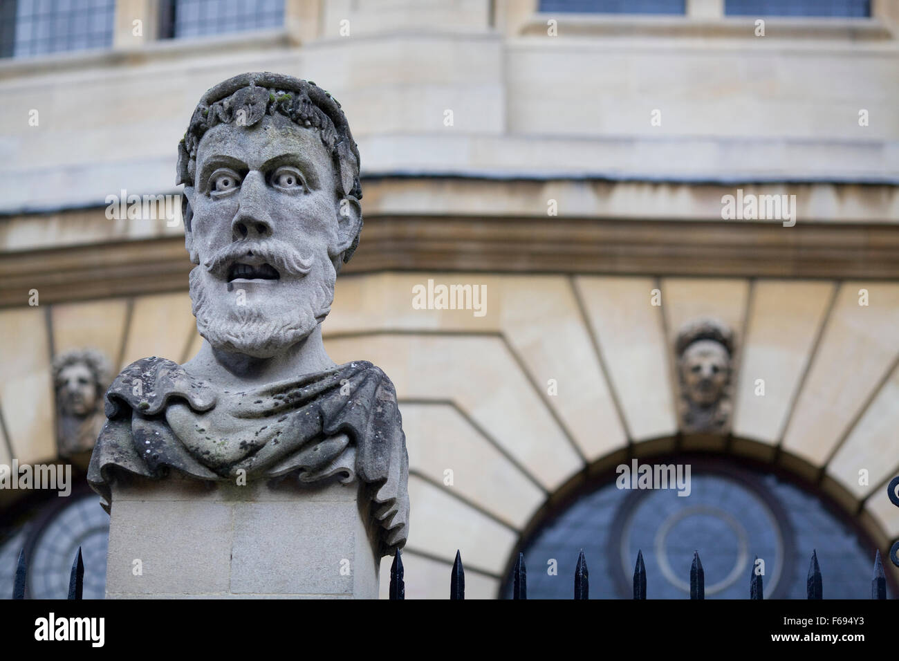 Carved stone busts on plinths outside Sheldonian theatre, Oxford, England Stock Photo